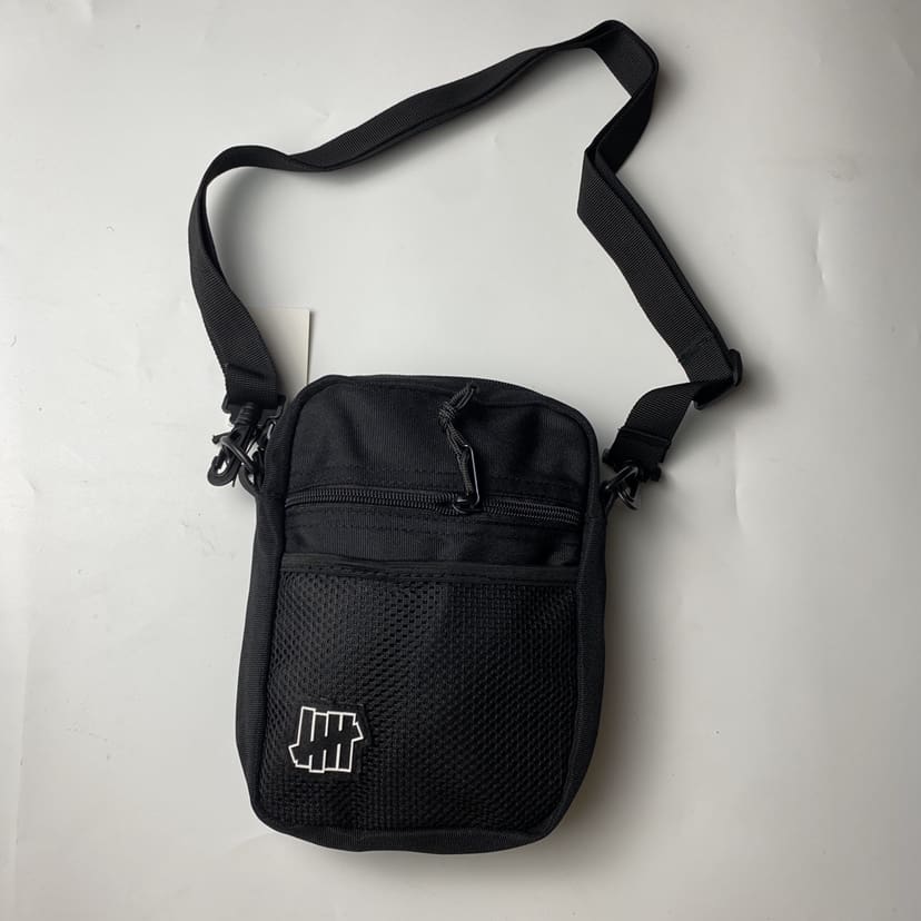 Undefeated Five-Stroke Armband Crossbody Bag