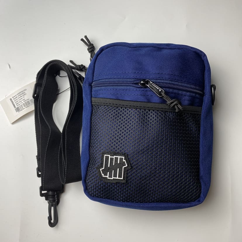Undefeated Five-Stroke Armband Crossbody Bag