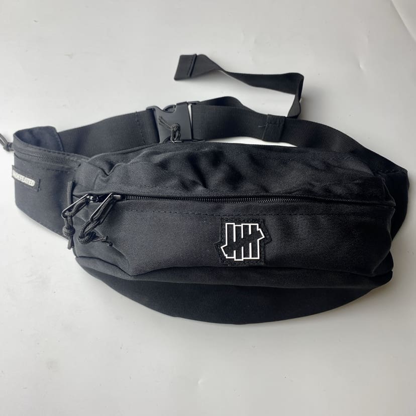 Undefeated Five-Stroke Armband Crossbody Bag