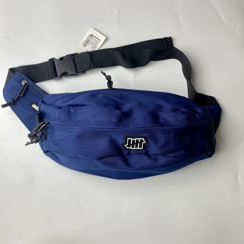 Undefeated Five-Stroke Armband Crossbody Bag